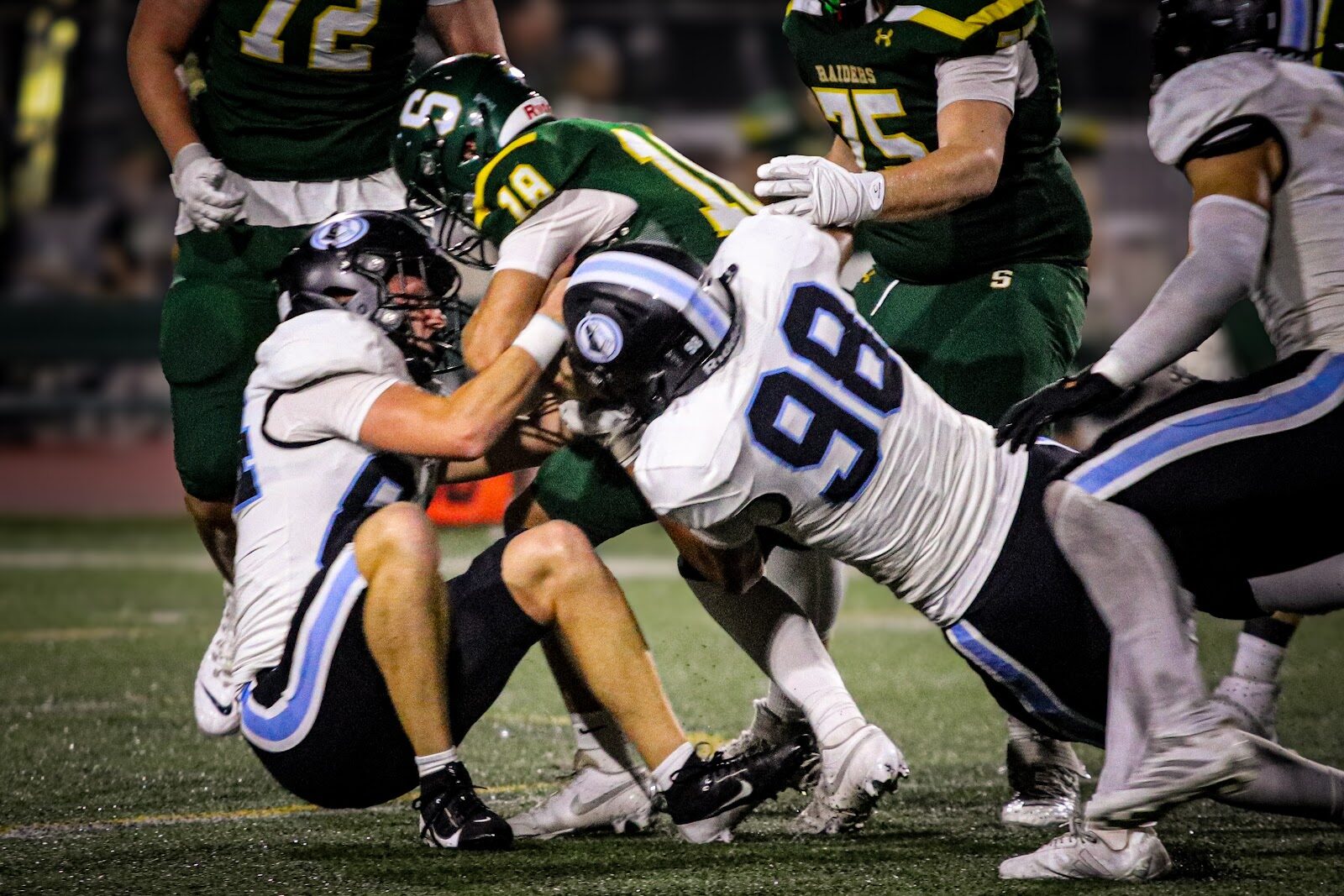 SME @ SM South — #98 and the Lancers defense wrap up a tackle